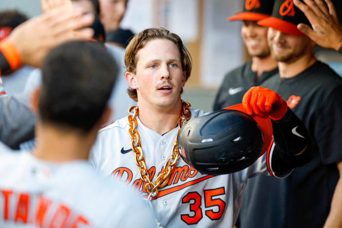 Jun 27, 2022; Seattle, Washington, USA; Baltimore Orioles catcher Adley Rutschman (35) celebrates in the dugout after hitting a solo-home run against the Seattle Mariners during the third inning at T-Mobile Park.